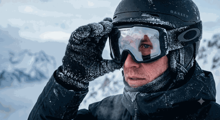 Промпт: Крупный план лыжника в очках с инеем, видимым логотипом OAKLEY